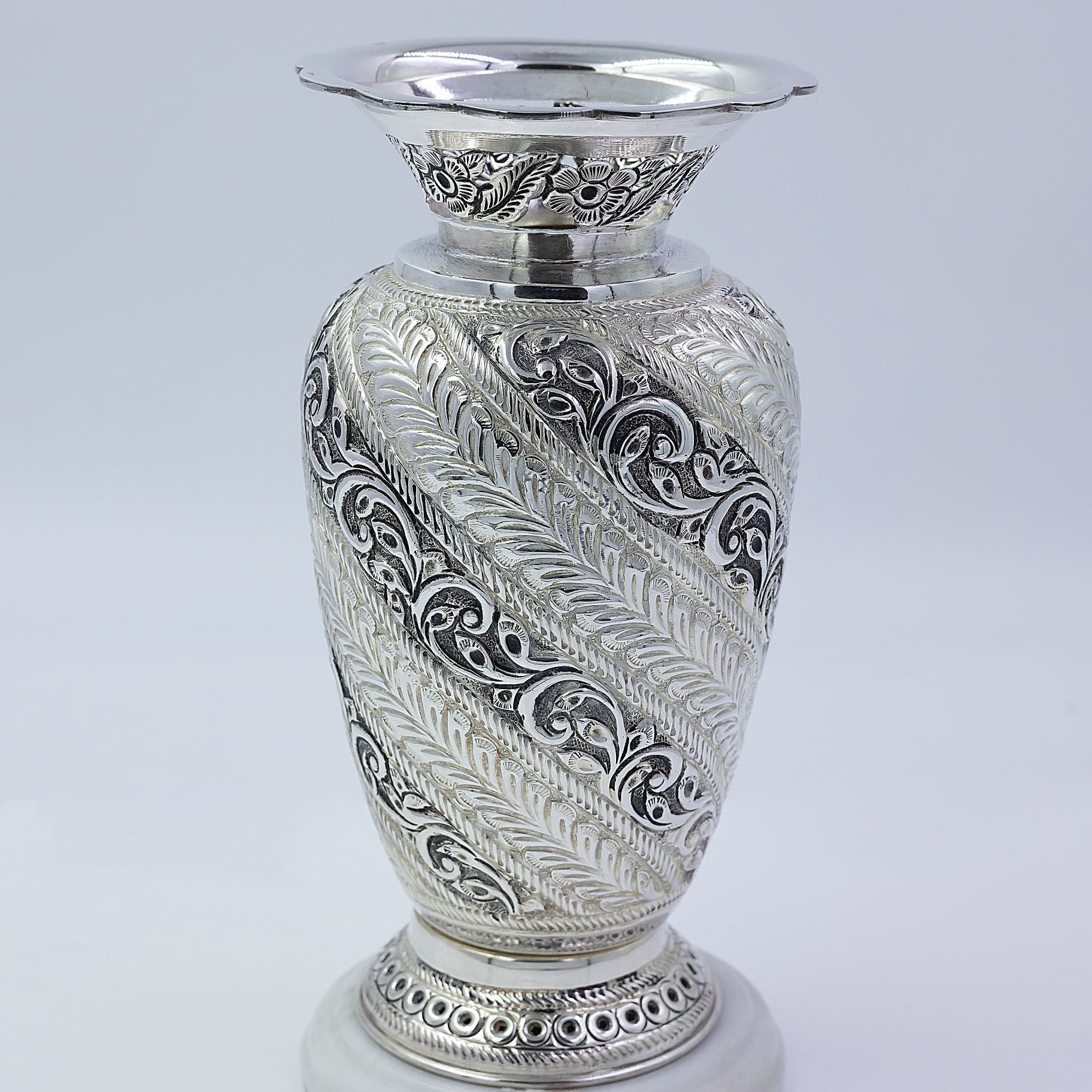 Alluring carved vase with Attractive stone Base silverhousebyrj