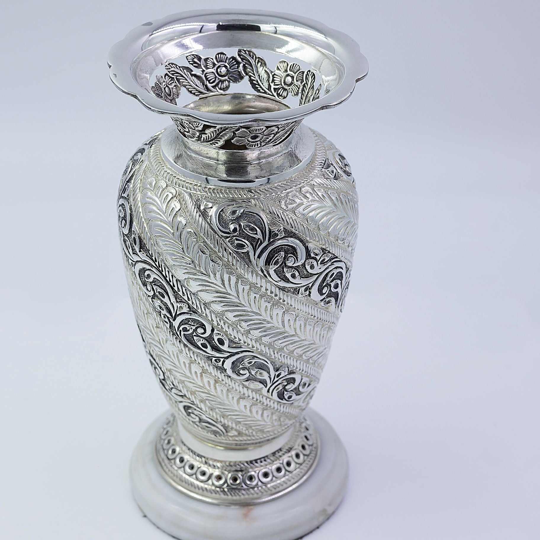 Alluring carved vase with Attractive stone Base silverhousebyrj